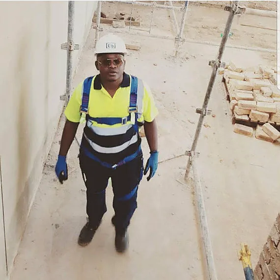 ATPGROUP supervisor in safety harness inspecting a site under construction